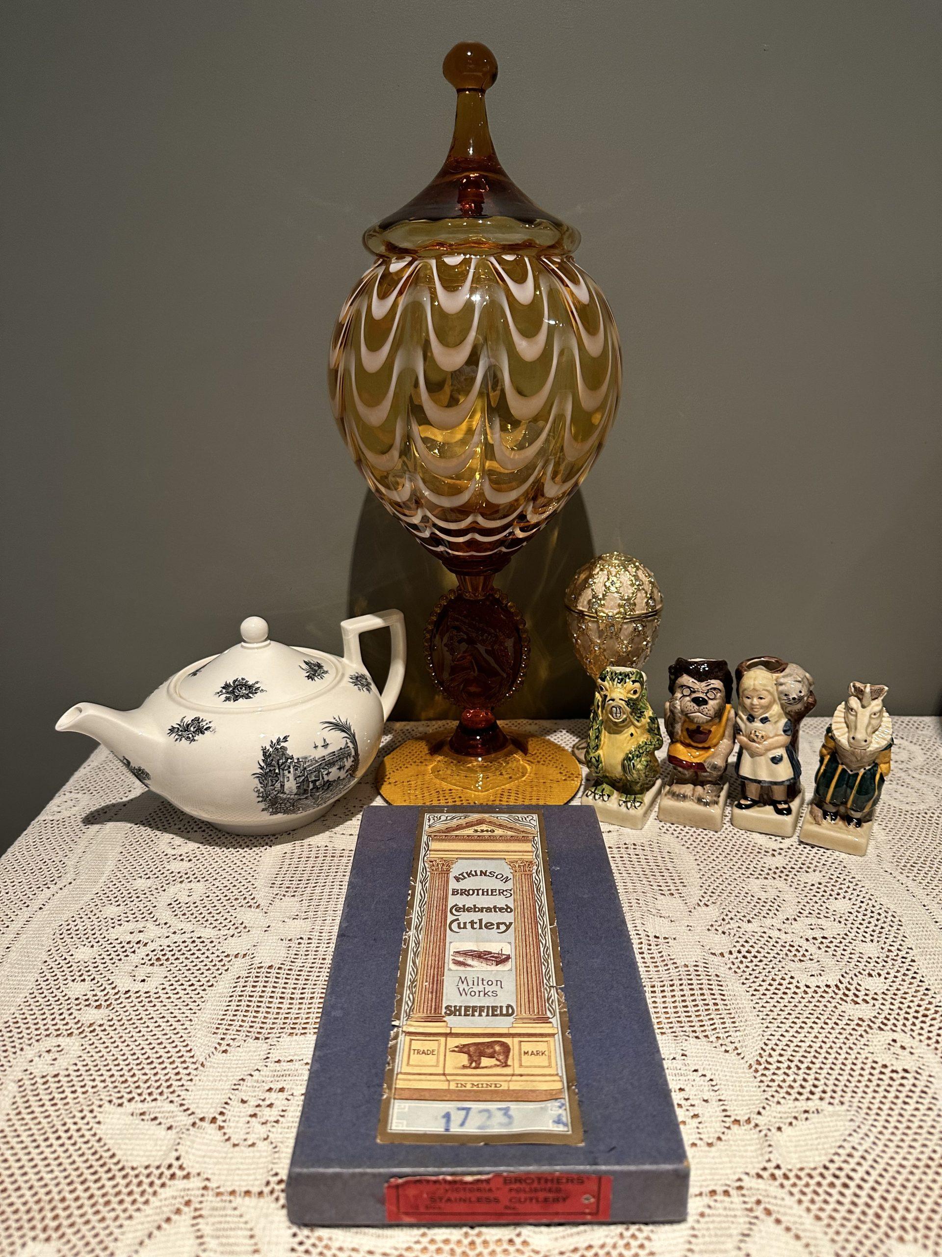 Sneak Peek For The Week – Amber Empoli Apothecary Jar, Tony Wood Alice In Wonderland Toby Jugs, Enameled Music Box, Superb Atkinson Brothers Faux Bone Handled Knives, Rare Wedgwood Rex Whistler Teapot