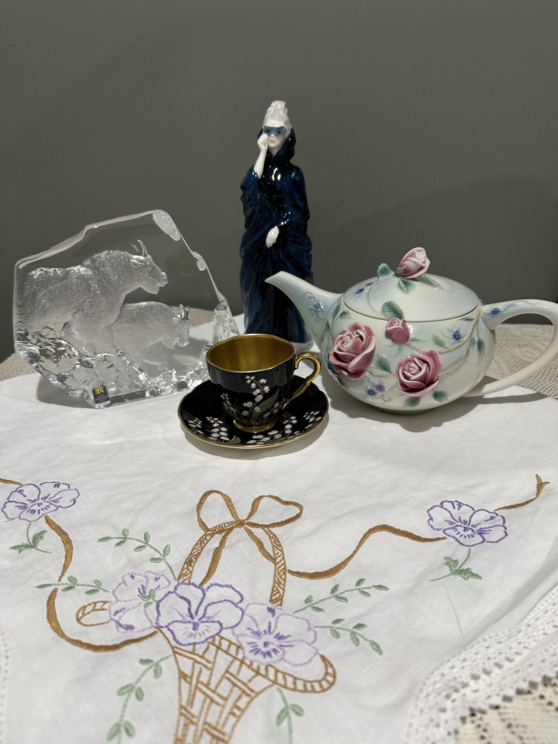 Sneak Peek For The Week – Royal Doulton Masque Figurine, Franz English Garden Rose Teapot, Hand Embroidered Tea Cloth, Mats Jonasson Mountain Goats Sculpture, Carlton Ware Noire Royale Lily Of The Valley Demitasse Duo