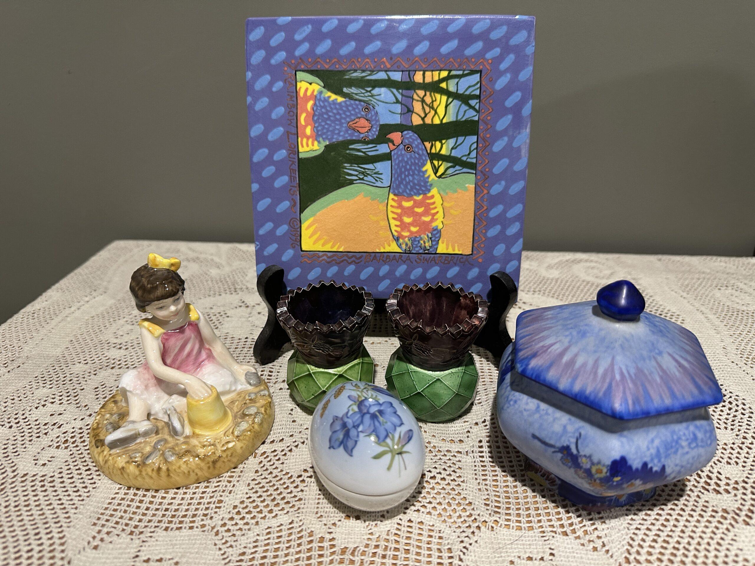 Sneak Peek For The Week – Royal Doulton On The Beach Figurine, Barbara Swarbrick Hand Painted Lorikeet Tile, Carlton Ware Garden Lidded Utility Bowl, Bing And Grondahl Limited Edition Egg Trinket, Rare Scottish Pair Of Bakelite Thistle Vases